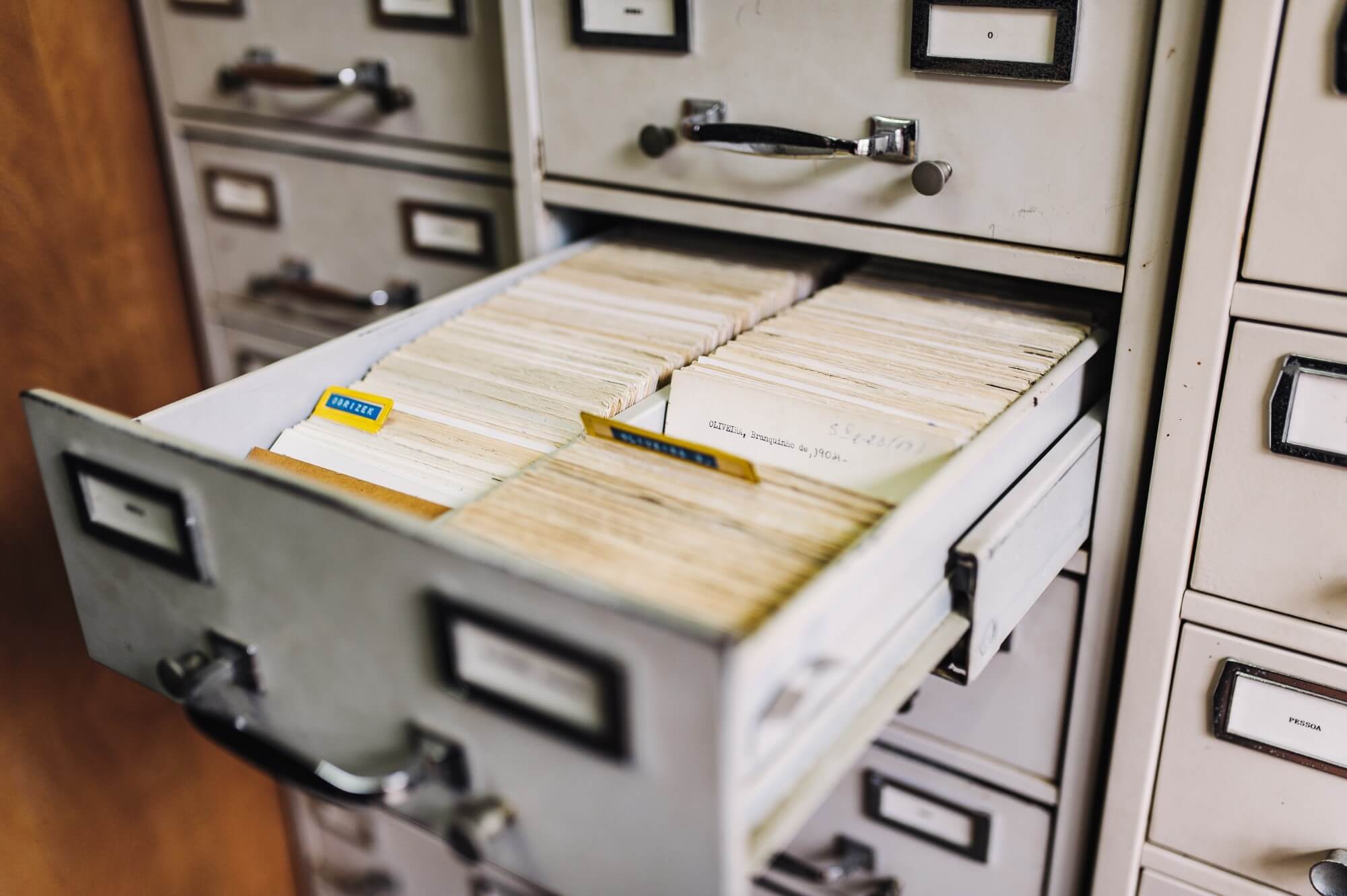 Open drawer of a filing cabinet containing folders of documents