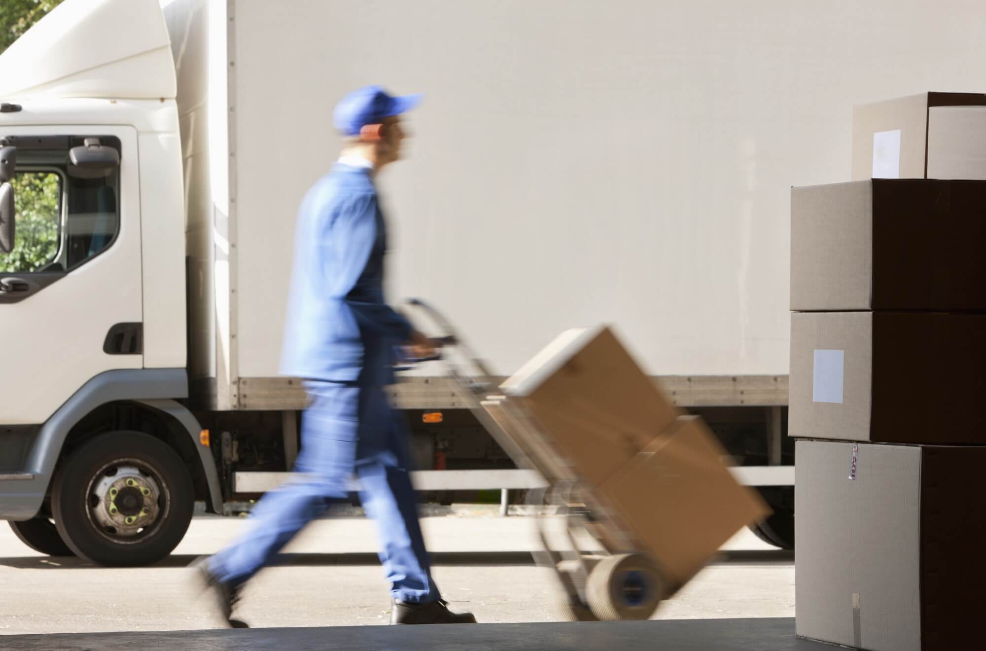 Person transporting boxes of shredded materials