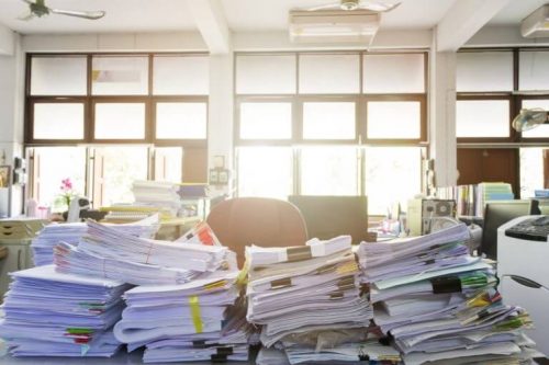 Piles of documents on a desk