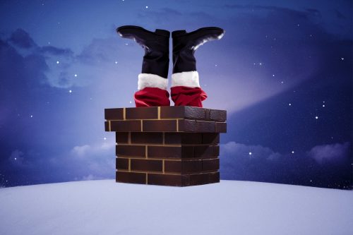 Santa going down a chimney with boots sticking out